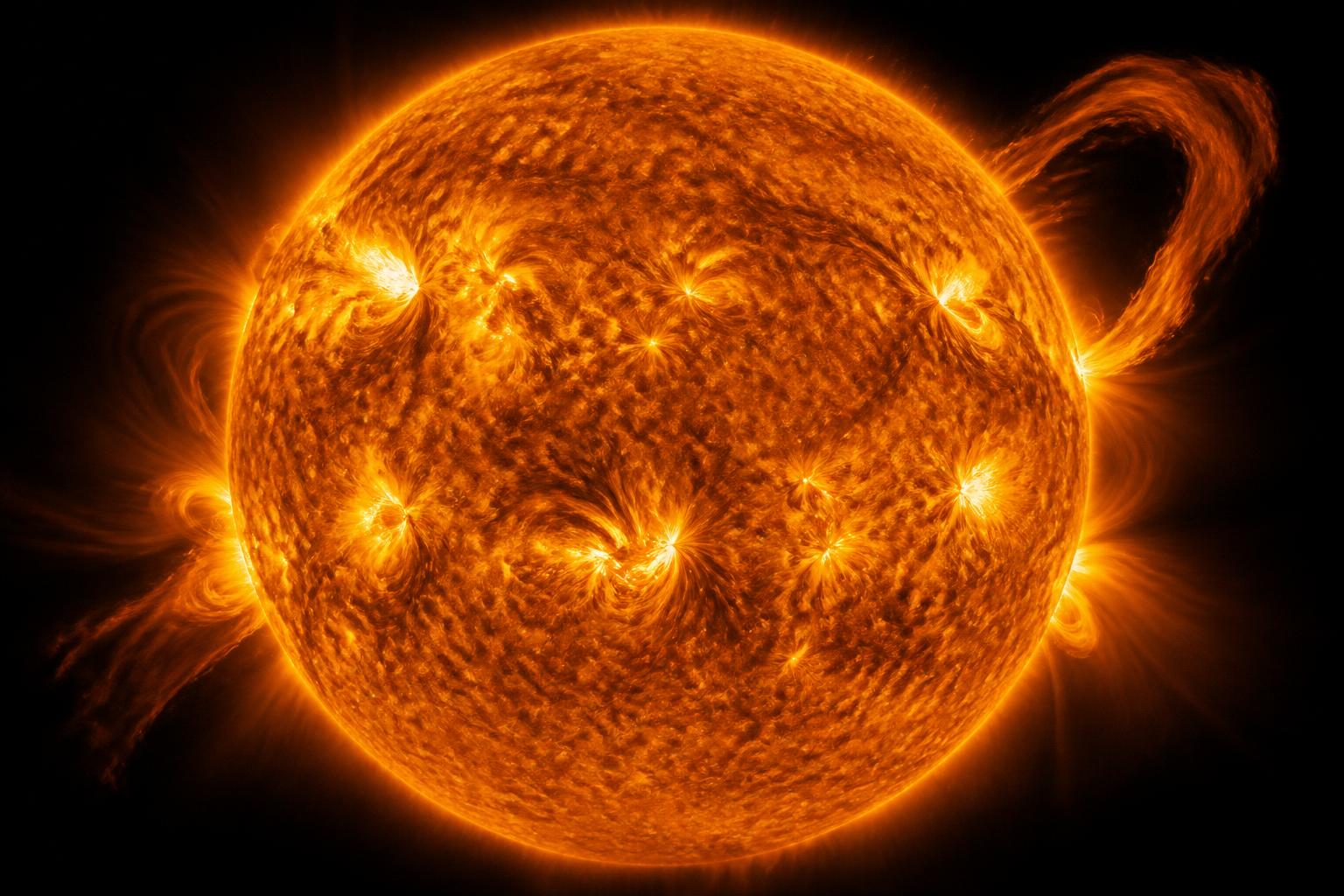 The Sun with prominences and granulated plasma surface