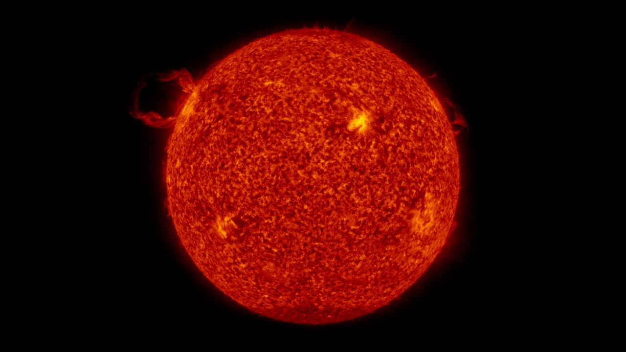 The Sun with prominences and granulated plasma surface